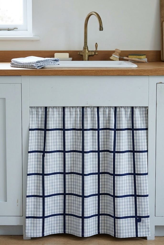Pale gingham cabinet skirt with a navy ribbon grid applied over the checked fabric